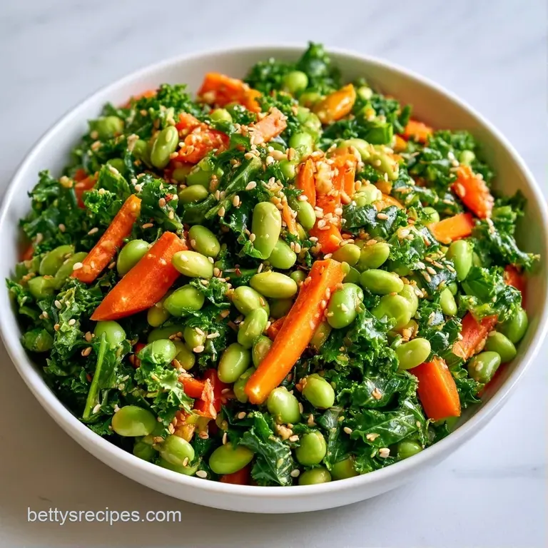 Fresh green soybeans and crisp leafy greens in a white bowl, accented by toasted seeds on a rustic light wood surface.